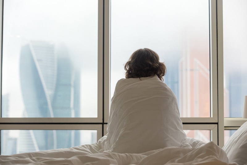 Young woman watching city view in the morning